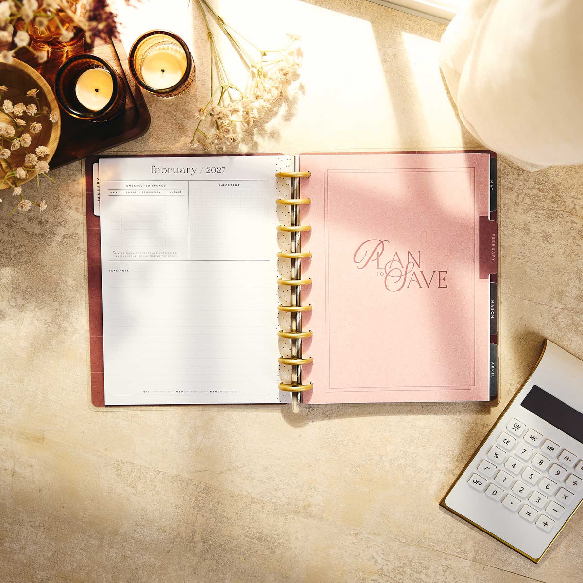 Amber & Oak Budget Planner February 2027 page and save money divider beside a calculator