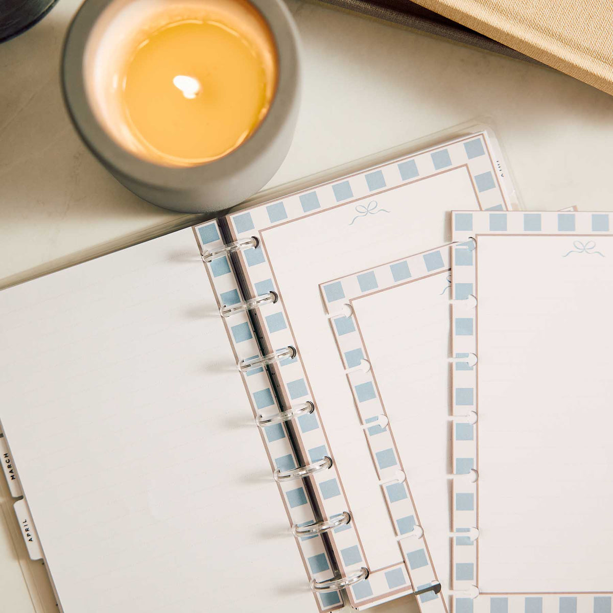 Modern Balance paper in a disc-bound planner with blue and peach borders