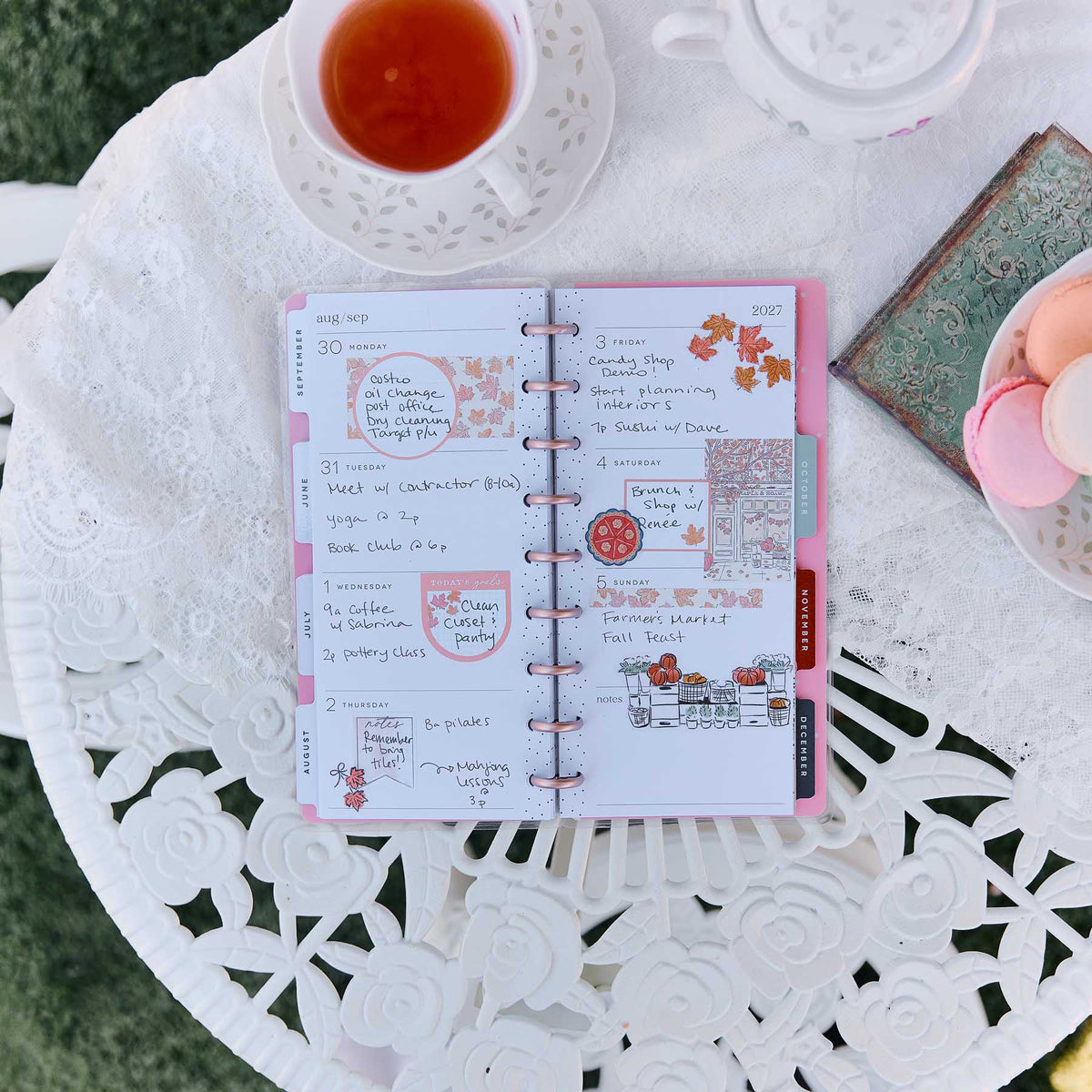 Happy Planner Seasonal Sidewalks open planner with handwritten plans and seasonal illustrations