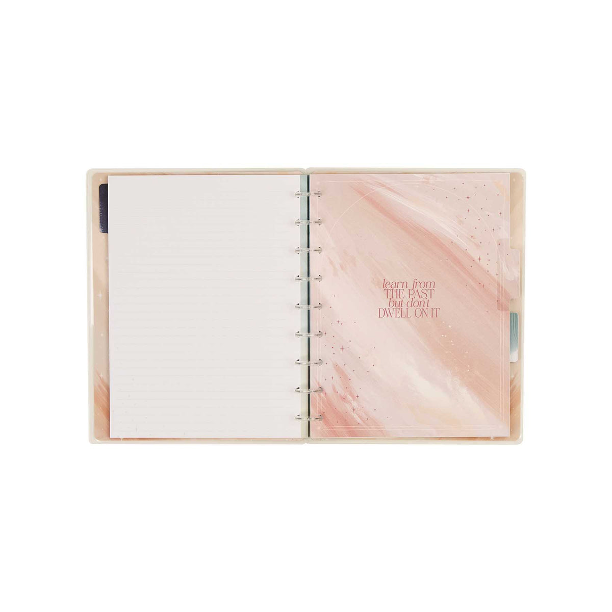 Starlit Glow notebook open to dotted-lined paper with a soft pink cover