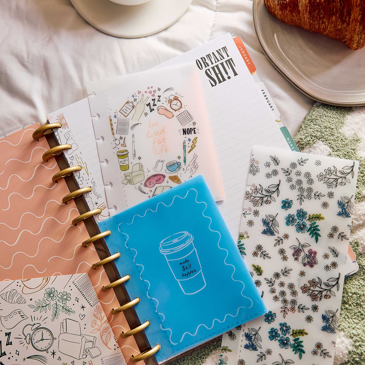 Pajama Plans planner pages with gold discs and floral stickers