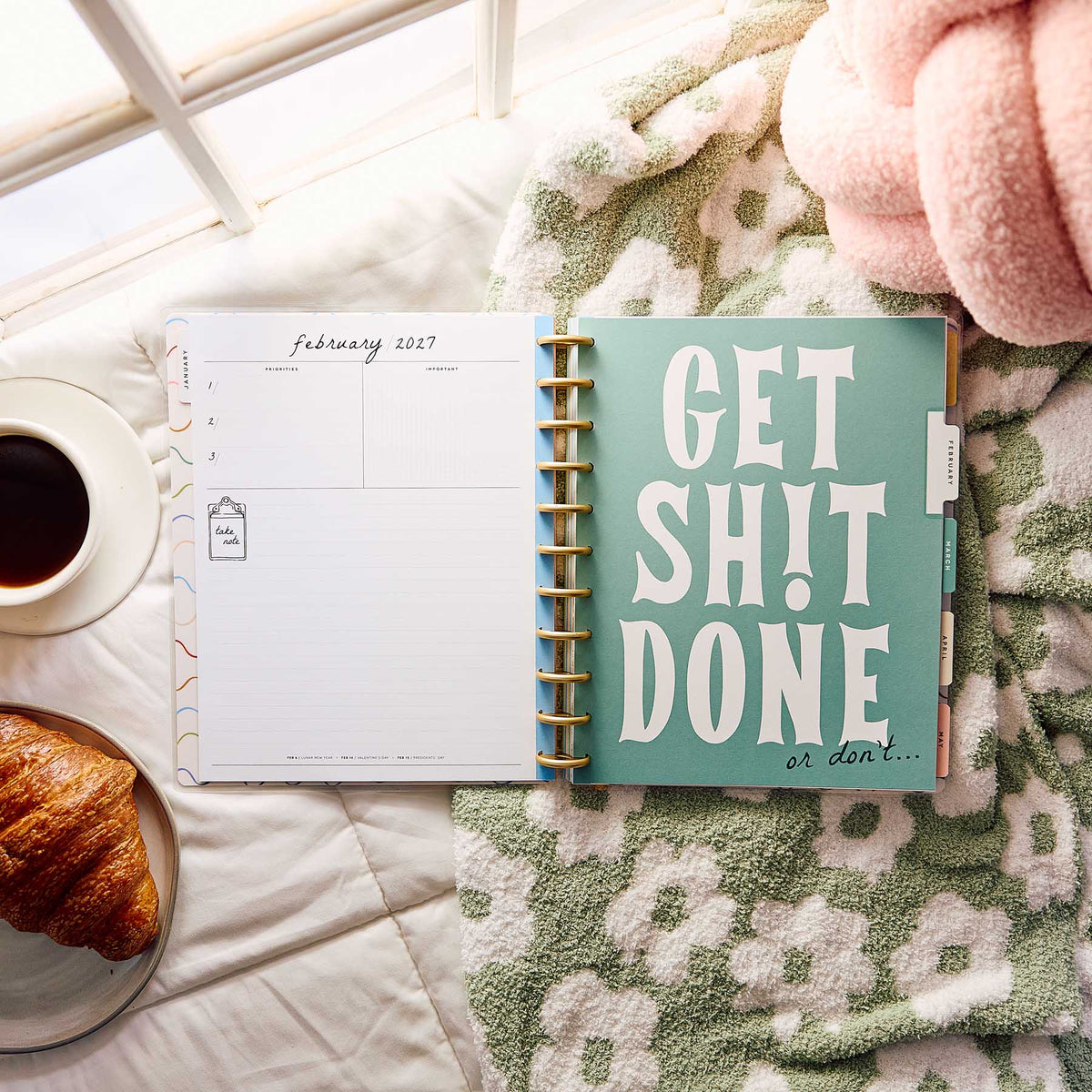 Happy Planner Pajama Plans open to a February 2027 spread and motivational divider