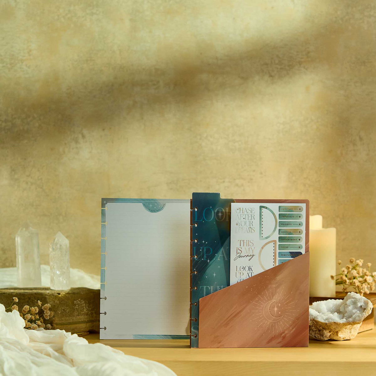 Open discbound planner with Starlit Glow filler paper and celestial folder
