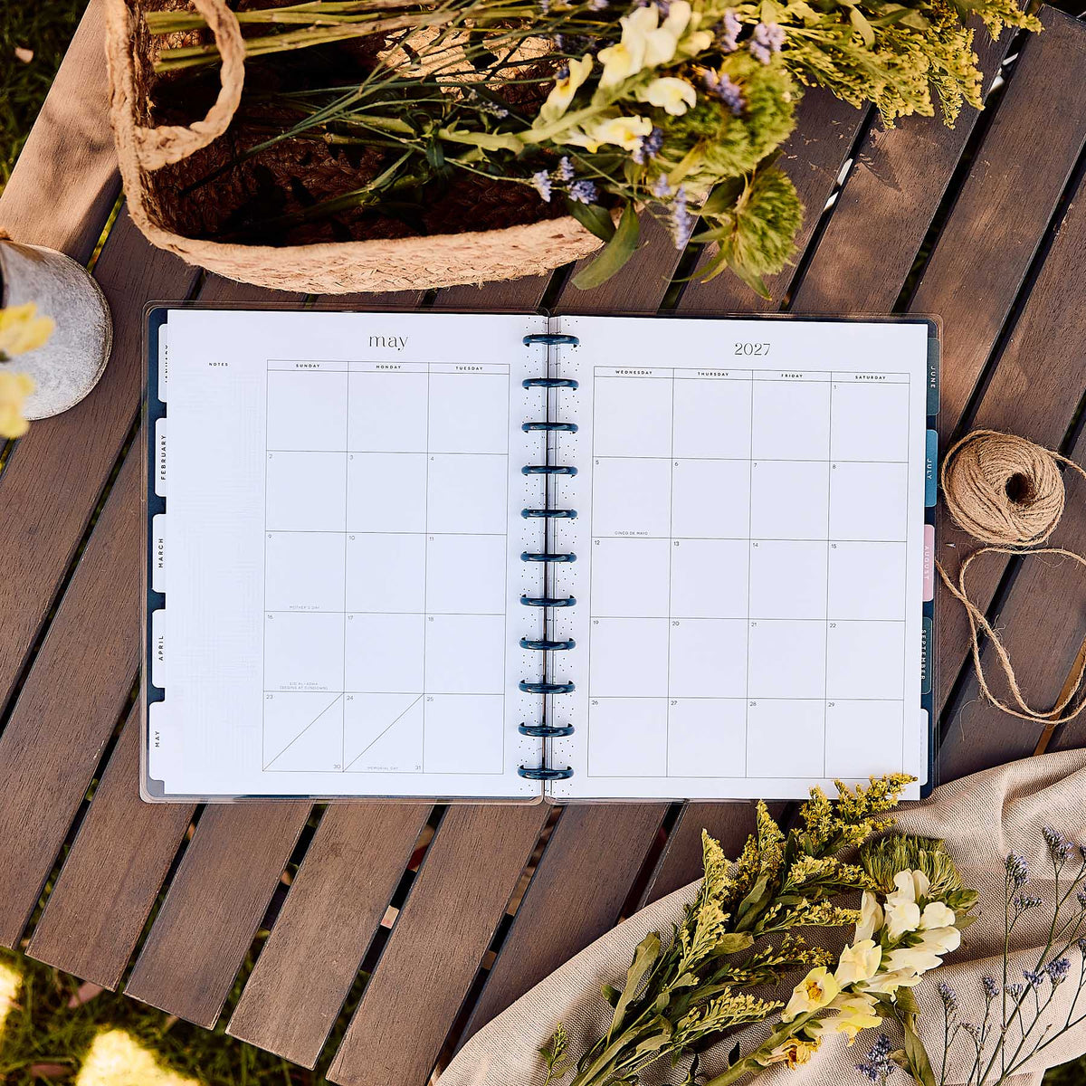 Wildflower Daydream Big monthly spread beside dried wildflowers on a wooden table
