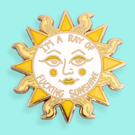 I'm A Ray Of Fucking Sunshine Lapel Pin gold-plated hard enamel lapel pin with a sun and rays design, featuring the text 'I'm a ray of fucking sunshine'.