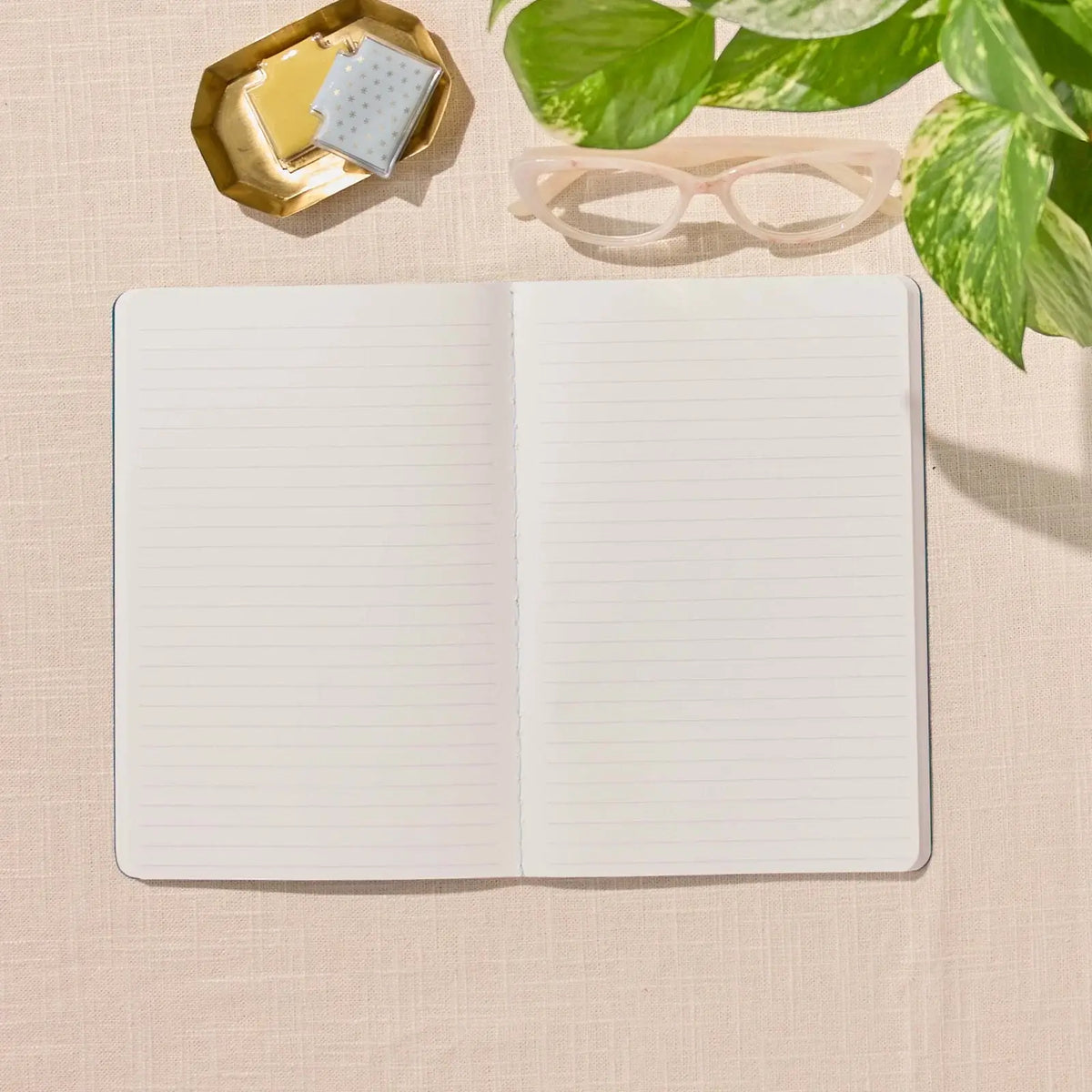 Erin Condren Petite Journal: Open lined Petite Journal on a desk