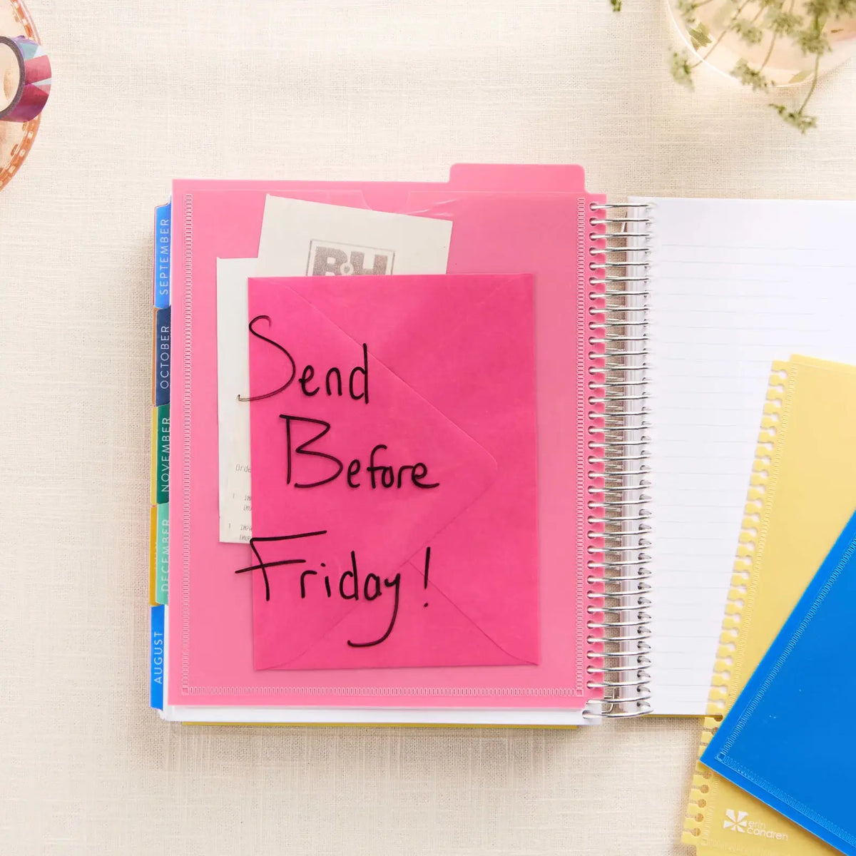 Erin Condren snap-in dashboard: Pink pocket dashboard holding notes with a handwritten reminder