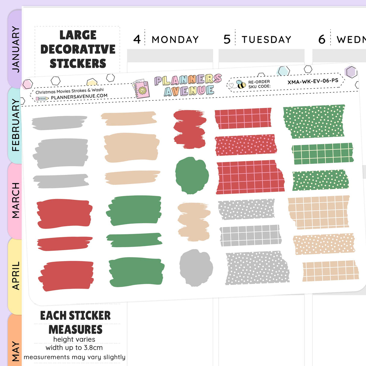 Collection of torn washi decorative stickers with various patterns and colours on a planner sheet.
