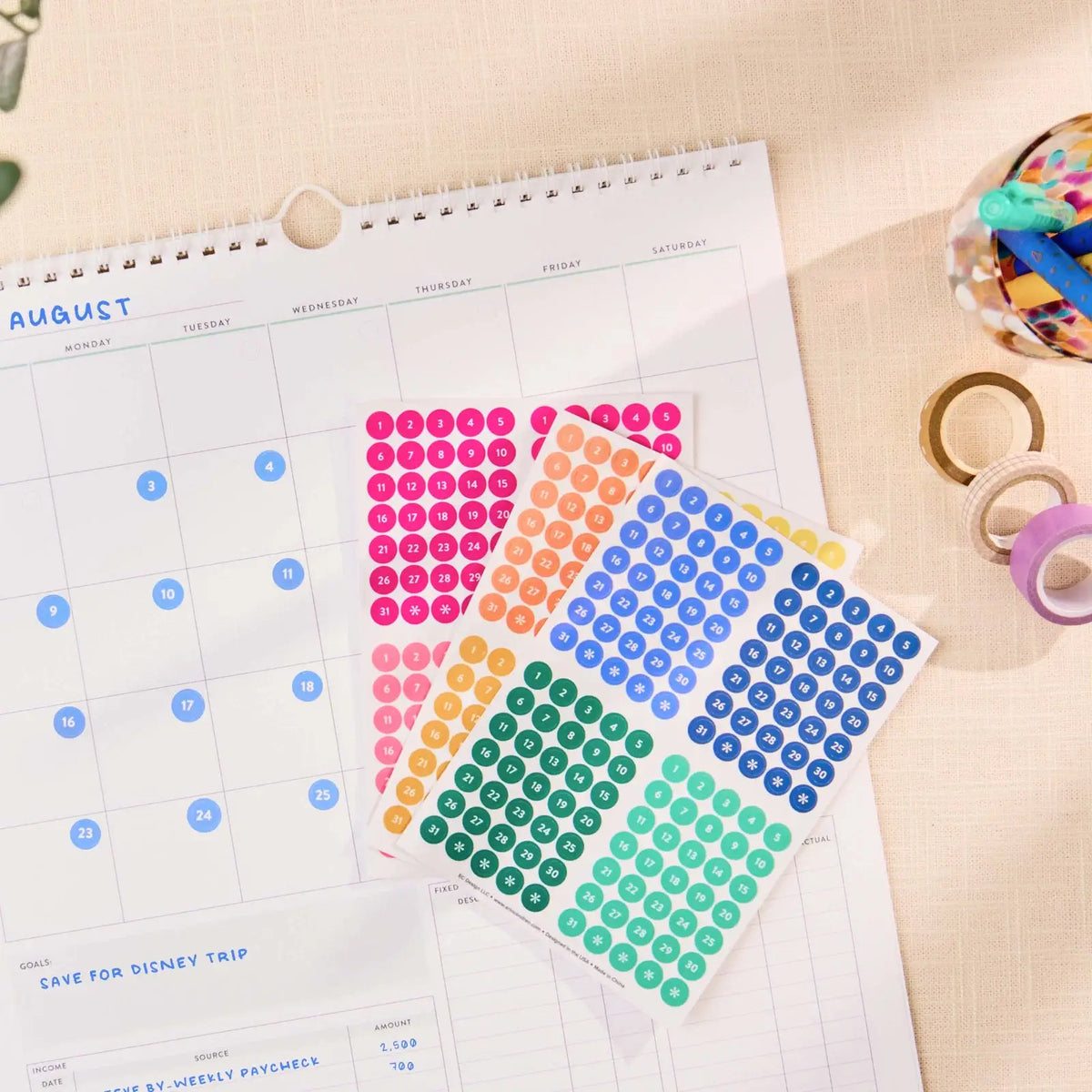 Erin Condren date dots: Clear date dots applied to an undated calendar page