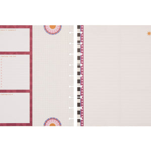 Planner pages with checklists and decorative elements on a light pink background