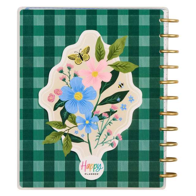 Planner with floral design and 'Happy Planner' logo on a green checkered background