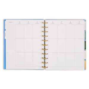 Open planner with daily grid layout on white background
