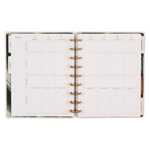 Open planner with weekly layout on white background