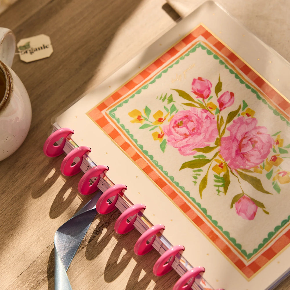 Happy Planner 2026 - 2027 French Papers Faith Classic 12 Month Dated  with floral design on a wooden surface