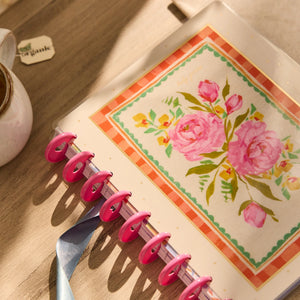 Happy Planner 2026 - 2027 French Papers Faith Classic 12 Month Dated  with floral design on a wooden surface