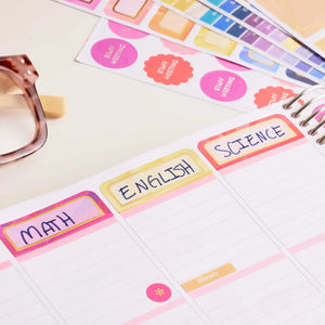 Erin Condren sticker book: Math, English and Science subject labels on a planning page