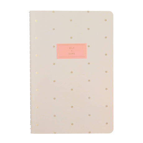 Erin Condren Self Care Journal Petite Planner - Asterisk Beige notebook with gold star patterns and a pink label on a white background