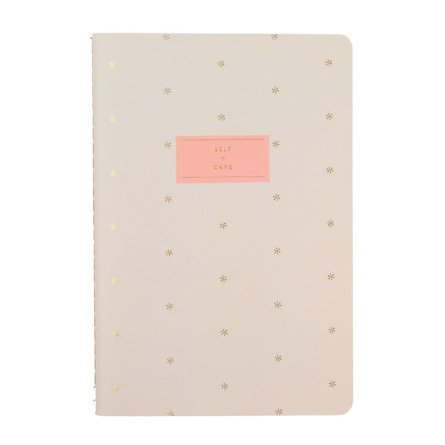 Erin Condren Self Care Journal Petite Planner - Asterisk Beige notebook with gold star patterns and a pink label on a white background