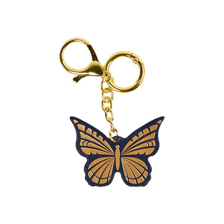 Butterfly planner charm showing gold-coloured wing details, dark blue edging and gold-tone chain