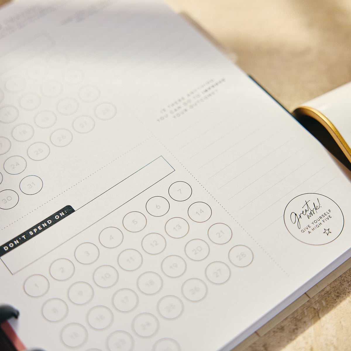 Open Amber & Oak budget journal showing circular spending prompts