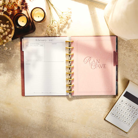 Amber & Oak Budget Planner February 2027 page and save money divider beside a calculator