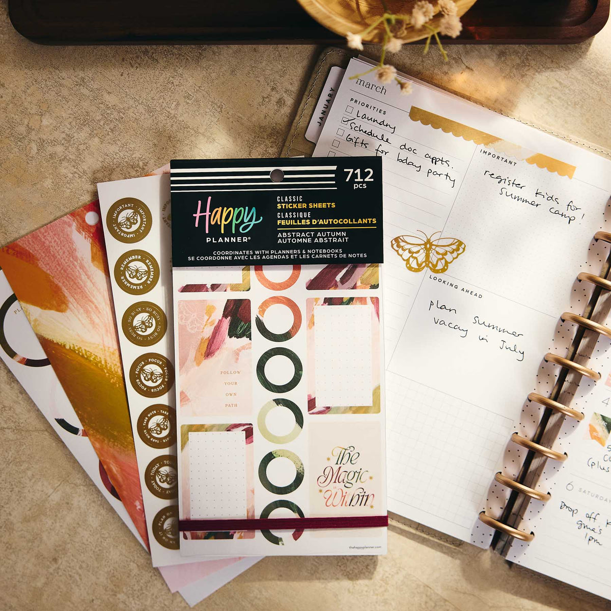 Abstract Autumn geometric stickers beside an open disc-bound planner and botanical accents