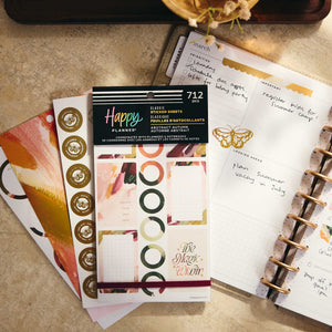 Abstract Autumn geometric stickers beside an open disc-bound planner and botanical accents