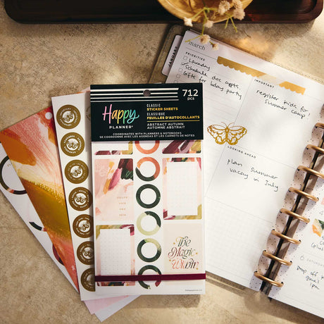 Abstract Autumn geometric stickers beside an open disc-bound planner and botanical accents