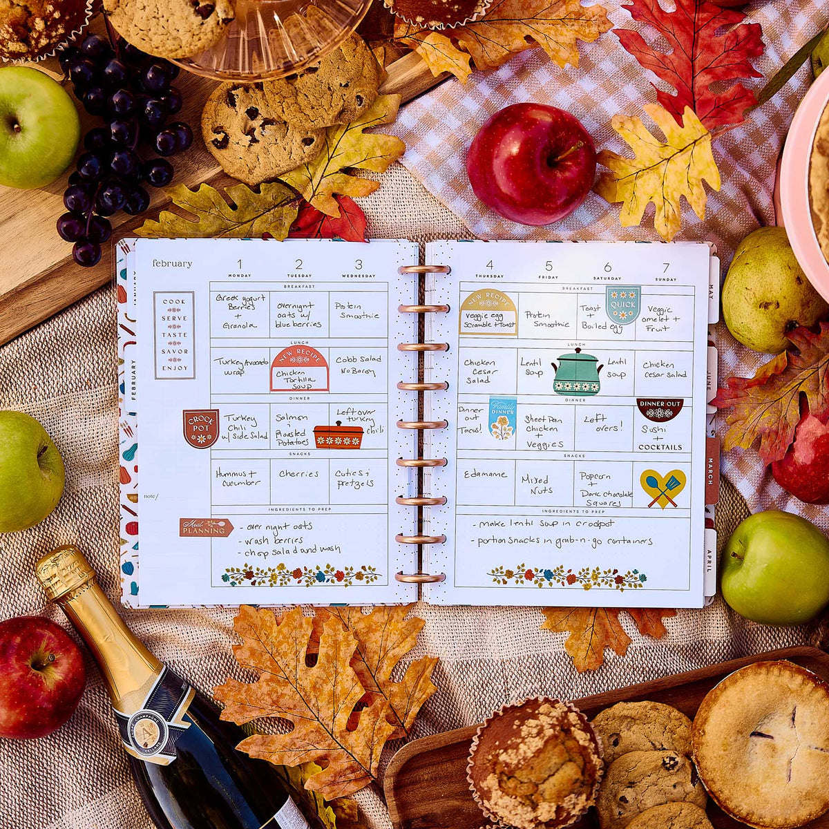 Handwritten weekly meal plans in the Fall Picnic planner beside picnic foods and autumn leaves