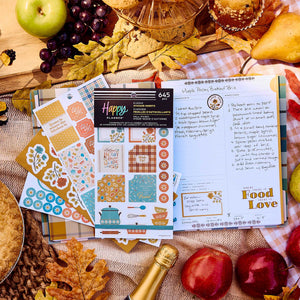 Fall Picnic Meal Planning sticker book beside a handwritten recipe page, fruit and autumn picnic decorations