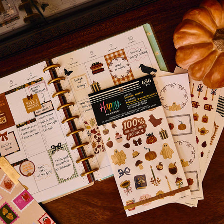 Favorite Season sticker book and pumpkin sticker sheets on an autumn-decorated disc-bound planner spread