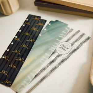 Modern Balance Classic Bookmarks arranged on a desk, showing the bow, green marbled and striped designs