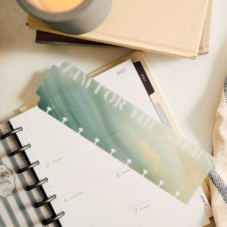 Green marbled Modern Balance bookmark marking a page in an open Classic Happy Planner