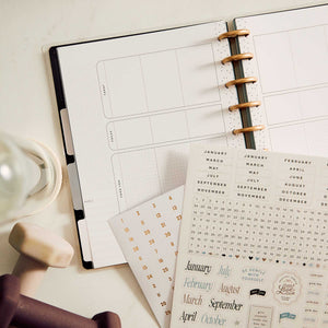 Haven & Heart Fitness Classic monthly calendars and date stickers on a desk