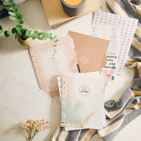 Happy Planner Modern Balance calendar inserts and guided planning pages on a desk