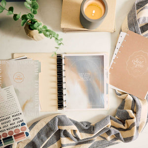 Modern Balance extension pages in a disc-bound planner with calendar, stickers and coffee