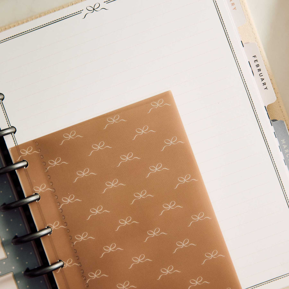 Haven & Heart lined pages with a patterned brown divider and monthly tabs