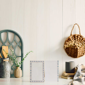 Modern Balance dotted-lined paper on a table beside books and home decor