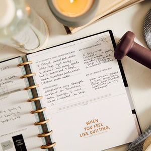 Open Haven & Heart Fitness journal with handwritten workout reflections