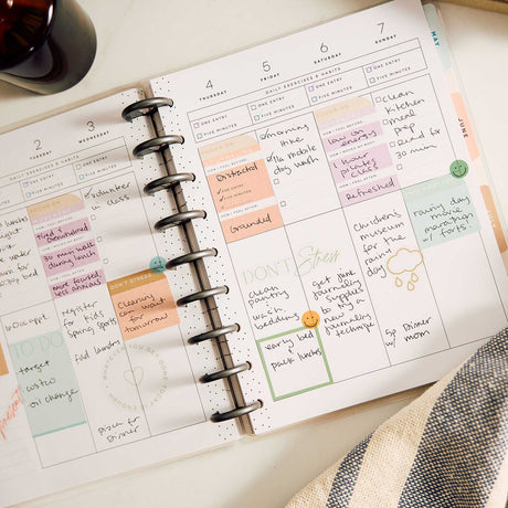 Hushed Hues handwritten weekly spread with pastel sections and disc binding