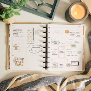 Haven & Heart planner open with handwritten notes and decorative stickers