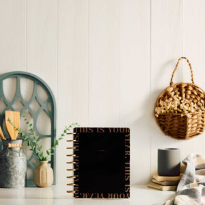 Happy Planner Haven & Heart Classic daily undated planner - black cover displayed in a home setting