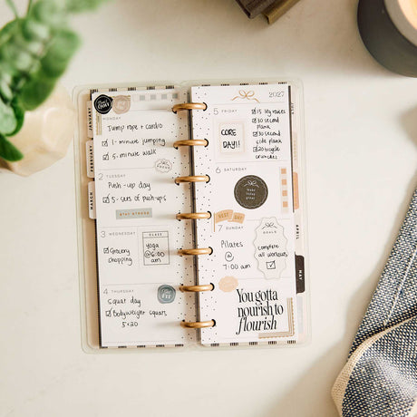 Happy Planner Haven and Heart open planner with handwritten plans, stickers and motivational lettering