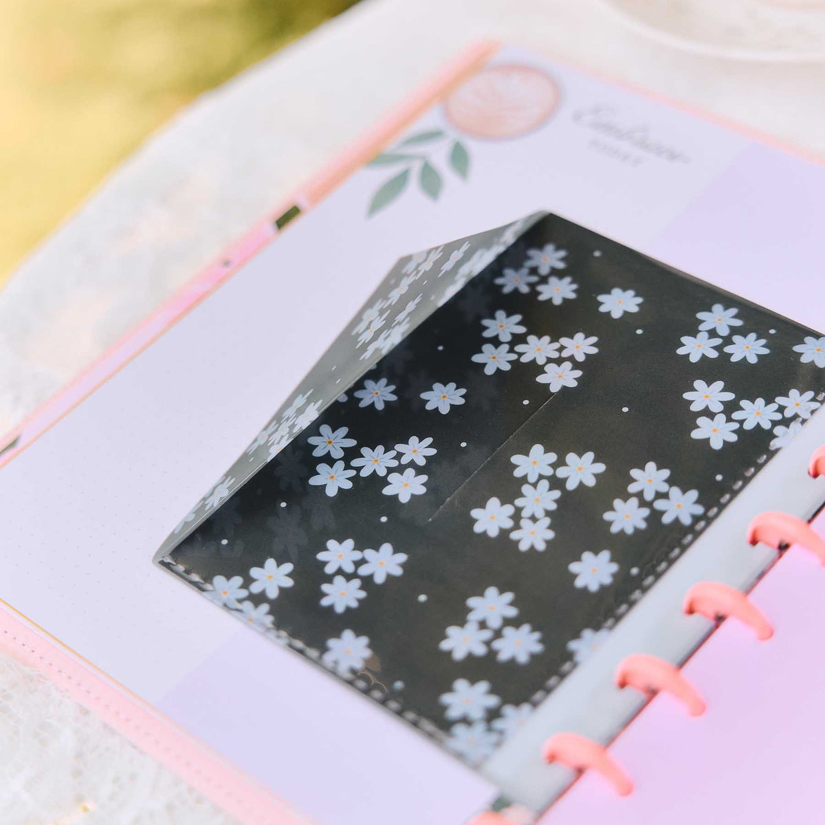 Petal Press black floral dashboard in a lavender discbound planner