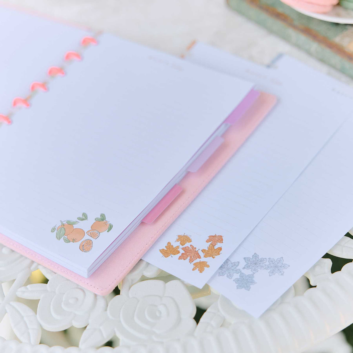 Seasonal Sidewalks pastel floral pages in a disc-bound planner