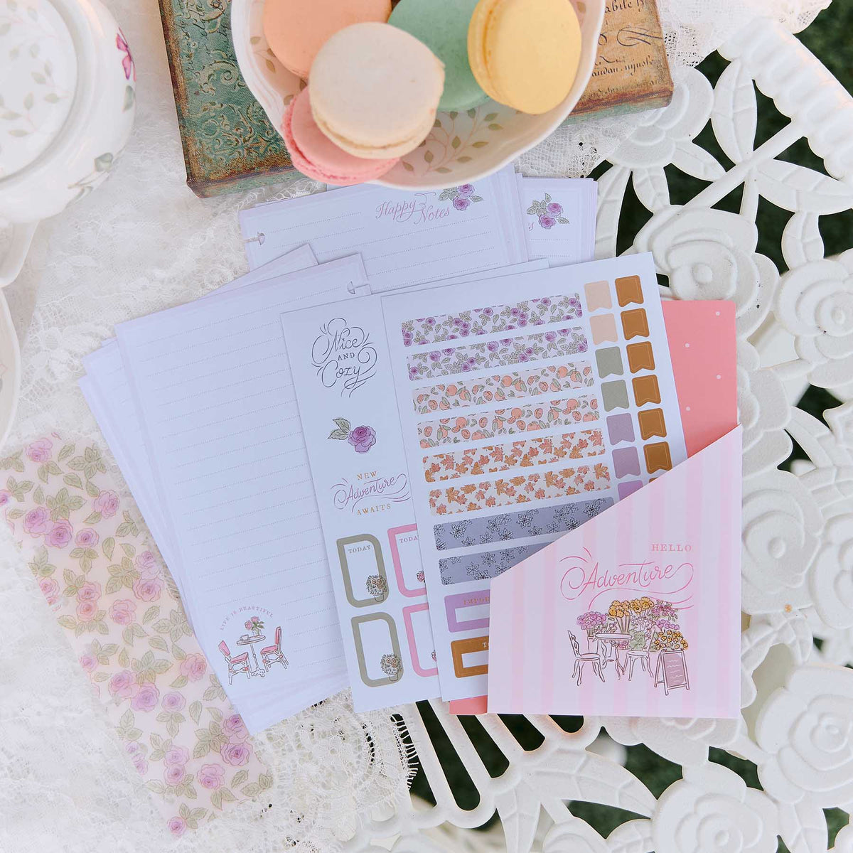 Seasonal Sidewalks Mini floral stickers and planner sheets on a floral tabletop