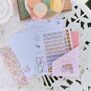 Seasonal Sidewalks Mini floral stickers and planner sheets on a floral tabletop