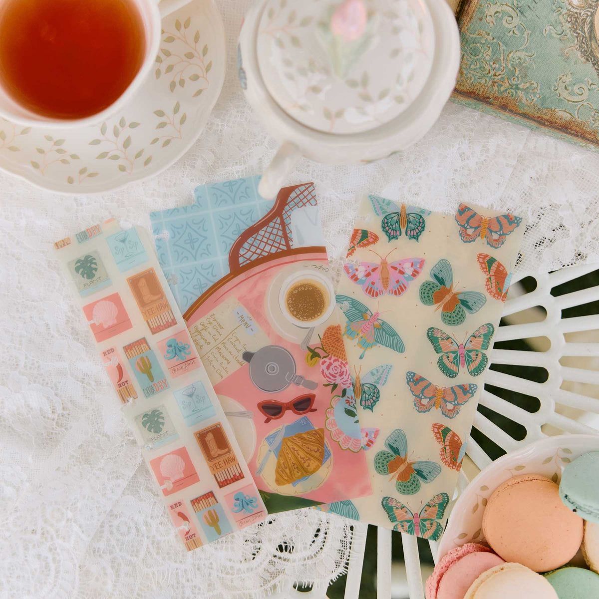 Life In Whimsy butterfly and travel dashboards styled with stickers, tea and stationery