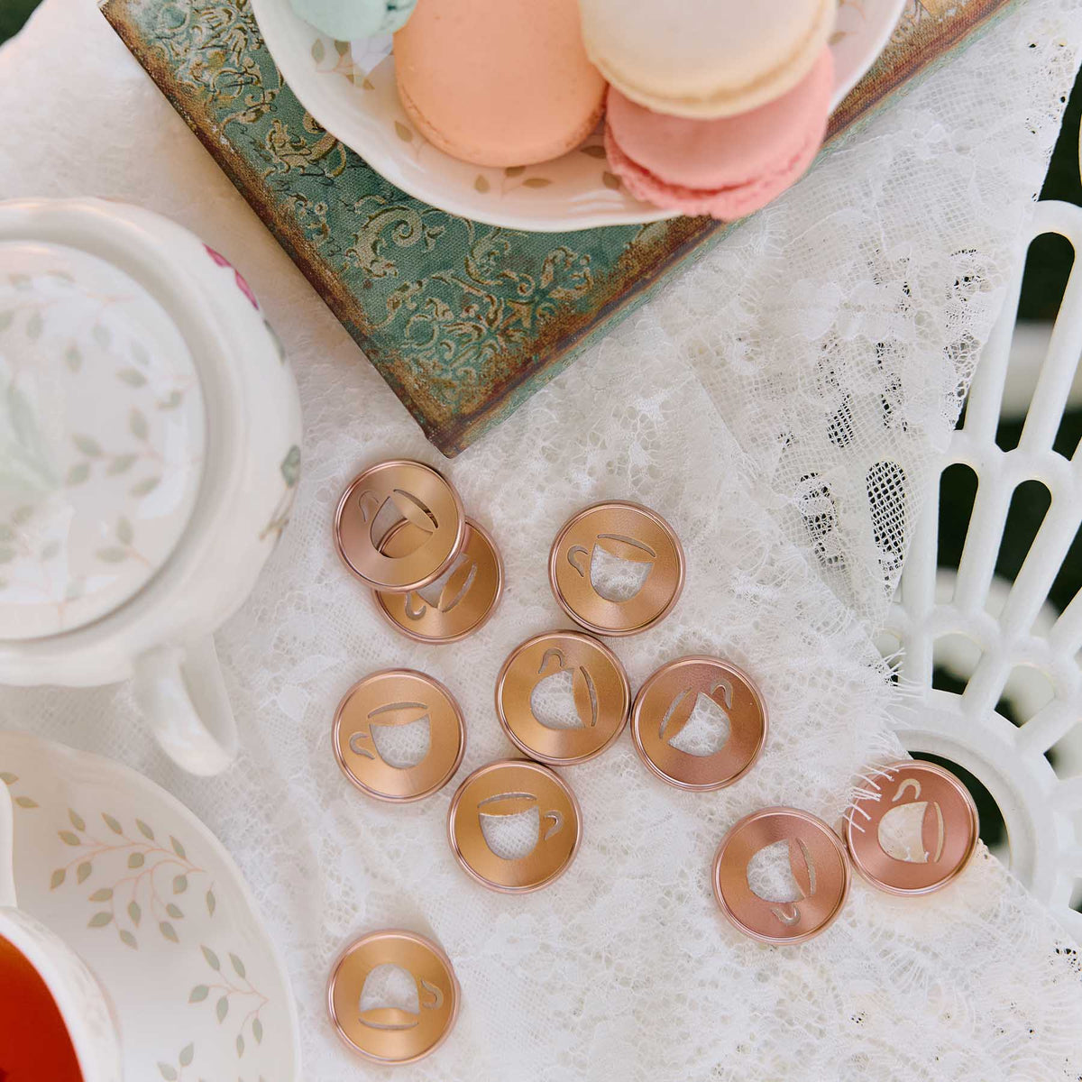 Latte coffee cup discs arranged on a lace tablecloth