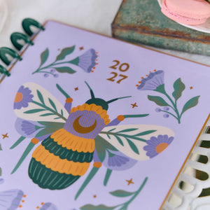 Hive and Bloom planner lavender cover with colourful bee and floral illustrations